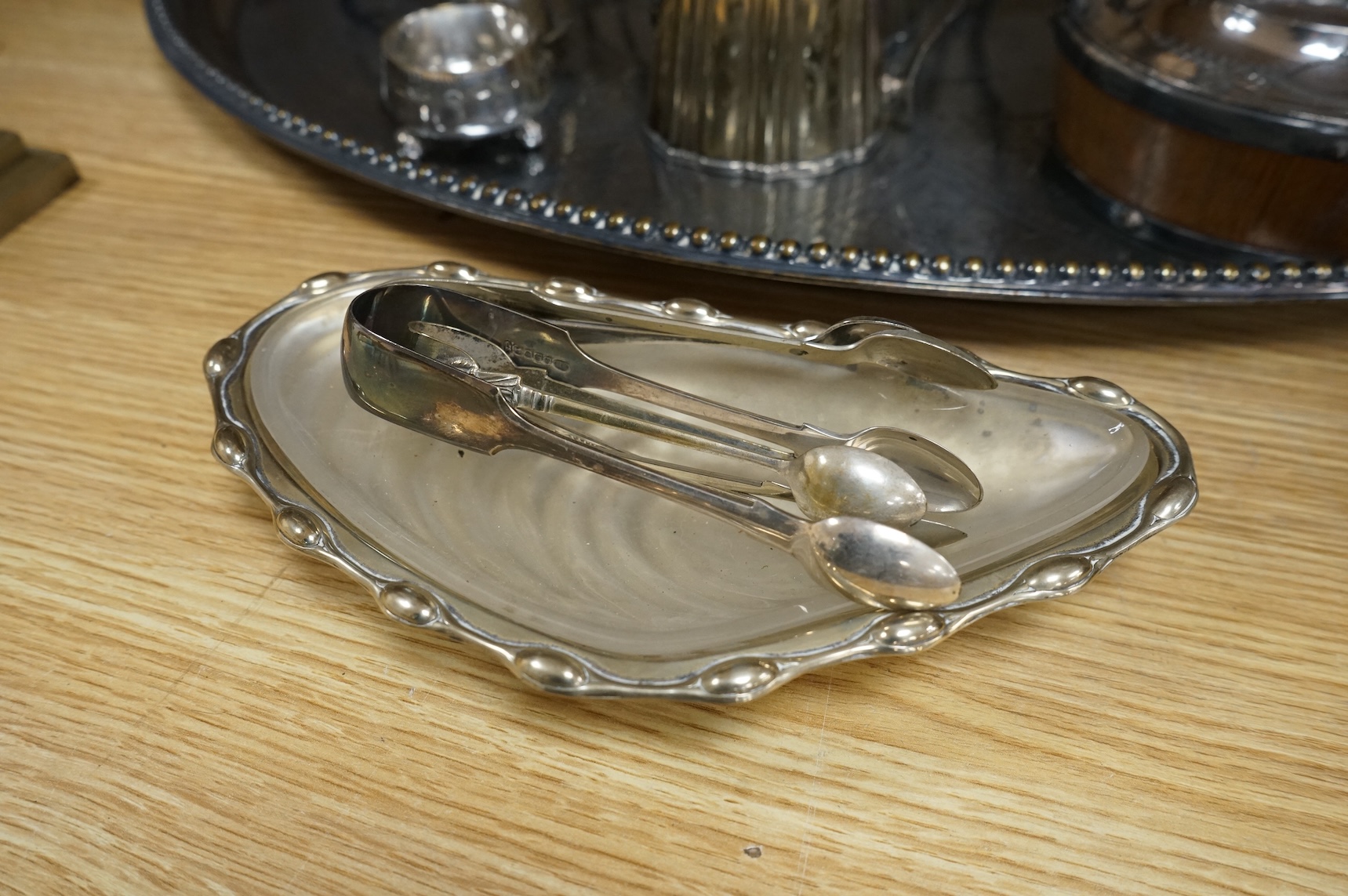 A collection of Victorian plated wares to include a pair of Corinthian column candelabra, 54cm